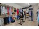 Spacious walk-in closet provides ample storage with custom shelving and racks at 13225 Snow Owl Dr, Carmel, IN 46033