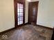 Bedroom showcasing hardwood floors, a glass paneled door, and closet, awaiting modernization at 1325 S Hackley St, Muncie, IN 47302