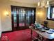 Dining room featuring vintage chandelier and glass paneled doors, with space for table and chairs at 1325 S Hackley St, Muncie, IN 47302