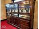 Close-up of classic dining room hutch with decorative glass doors and vintage design at 1325 S Hackley St, Muncie, IN 47302