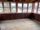 Sunroom showcasing hardwood floors and lots of natural light through multiple windows, great for relaxation at 1325 S Hackley St, Muncie, IN 47302