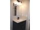 Modern bathroom vanity with granite countertop and modern fixtures at 150 E Troy Ave, Indianapolis, IN 46225