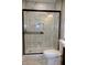Bright bathroom features a sleek glass shower and modern fixtures, creating a clean and inviting space at 150 E Troy Ave, Indianapolis, IN 46225