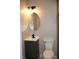 Modern bathroom with updated vanity, fixtures, and mirror adding a touch of luxury to the space at 150 E Troy Ave, Indianapolis, IN 46225