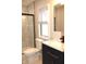 Modern bathroom featuring a black framed shower, toilet, and a sleek vanity with stone countertop at 150 E Troy Ave, Indianapolis, IN 46225