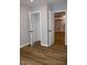 Bedroom view with an open closet door and a glimpse into a kitchen with white cabinets at 150 E Troy Ave, Indianapolis, IN 46225