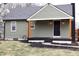Charming home featuring an inviting covered porch with wooden accents at 150 E Troy Ave, Indianapolis, IN 46225