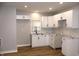 Modern kitchen featuring white cabinets and subway tile backsplash at 150 E Troy Ave, Indianapolis, IN 46225