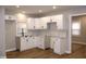 Modern kitchen featuring white cabinets and subway tile backsplash at 150 E Troy Ave, Indianapolis, IN 46225
