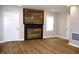 Modern living room with stylish wood accent wall and hardwood floors at 150 E Troy Ave, Indianapolis, IN 46225
