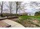 Backyard with wooden deck, outdoor seating, storage shed, and green lawn at 1550 Renee Dr, Plainfield, IN 46168