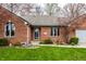 Charming brick home with a well-manicured lawn, and a cozy front entrance at 1550 Renee Dr, Plainfield, IN 46168