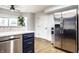 Kitchen features stainless steel appliances, hardwood floors and breakfast bar at 1550 Renee Dr, Plainfield, IN 46168