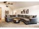 Spacious living room offering generous seating with large comfy sectional and ceiling fan at 1550 Renee Dr, Plainfield, IN 46168