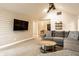 Open concept living area featuring modern furnishings and a wall-mounted television at 1550 Renee Dr, Plainfield, IN 46168