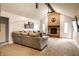 Cozy living room features a brick fireplace, vaulted ceiling, and plush seating at 1550 Renee Dr, Plainfield, IN 46168