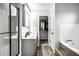 Bright bathroom featuring double sinks, shower, soaker tub, and walk-in closet at 1550 Renee Dr, Plainfield, IN 46168