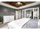 Comfortable main bedroom with ensuite bathroom, walk in closet and stylish wood tray ceiling at 1550 Renee Dr, Plainfield, IN 46168