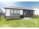 Charming backyard featuring a screened-in porch and lush green lawn at 15755 Scher Dr, Westfield, IN 46074