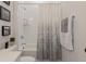 Bright bathroom featuring a tub-shower combo with stylish shower curtain and a modern vanity with stone countertop at 15755 Scher Dr, Westfield, IN 46074
