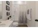 Bright bathroom featuring a tub-shower combo with stylish shower curtain and a modern vanity with stone countertop at 15755 Scher Dr, Westfield, IN 46074