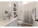Bright bathroom featuring a tub-shower combo with stylish shower curtain and a modern vanity with stone countertop at 15755 Scher Dr, Westfield, IN 46074