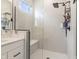 Modern bathroom with white tile, glass shower, and black fixtures at 15755 Scher Dr, Westfield, IN 46074