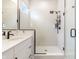 Modern bathroom featuring a glass-enclosed shower with black hardware, a rain shower head, and a modern vanity at 15755 Scher Dr, Westfield, IN 46074