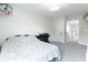 Bright bedroom with neutral carpet features a desk and chair, decorated with plush toys at 15755 Scher Dr, Westfield, IN 46074