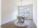 Bright dining area with modern chandelier and a round table with seating for four at 15755 Scher Dr, Westfield, IN 46074