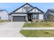 Charming home featuring a gray exterior, two-car garage, well-maintained lawn, and inviting front entrance at 15755 Scher Dr, Westfield, IN 46074