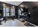 Dedicated home gym featuring weight training equipment and a television at 15755 Scher Dr, Westfield, IN 46074
