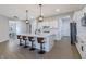 Bright kitchen island with modern bar stools, pendant lighting, and white cabinetry at 15755 Scher Dr, Westfield, IN 46074