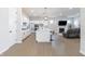 Open kitchen featuring white cabinets, island with seating, and stainless steel appliances at 15755 Scher Dr, Westfield, IN 46074