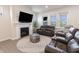 Bright living room features a modern fireplace, plush seating, and plenty of natural light at 15755 Scher Dr, Westfield, IN 46074