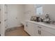 Mudroom with custom white cabinetry and plenty of room for coffee bar and storage at 15755 Scher Dr, Westfield, IN 46074