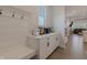 Comfortable and well organized mudroom area with a coffee bar and adjacent living room at 15755 Scher Dr, Westfield, IN 46074