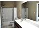 Neutral bathroom featuring a shower over the tub, and a double sink vanity with plenty of counter space at 1630 Valdarno Dr, Greenwood, IN 46143