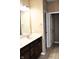 Bathroom features a double sink vanity with dark wood cabinets and a well-lit mirror at 1630 Valdarno Dr, Greenwood, IN 46143