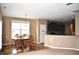 This dining room has an adjacent kitchen, hardwood floors, an overhead light, and six chairs at 1630 Valdarno Dr, Greenwood, IN 46143