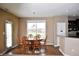 The dining room has hardwood floors, a table with six chairs, and is situated off the kitchen at 1630 Valdarno Dr, Greenwood, IN 46143