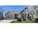Lovely home featuring brick exterior, manicured lawn, tidy landscaping, and a clean, inviting curb appeal at 1630 Valdarno Dr, Greenwood, IN 46143