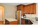 A kitchen view shows stainless steel refrigerator and sink with a center island at 1630 Valdarno Dr, Greenwood, IN 46143