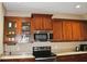 A kitchen shows wood cabinets, granite countertops, and stainless steel microwave at 1630 Valdarno Dr, Greenwood, IN 46143