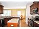 A kitchen view shows stainless steel appliances, wood cabinets and an eat in kitchen at 1630 Valdarno Dr, Greenwood, IN 46143