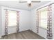 Neutral bedroom features a ceiling fan and windows with modern patterned curtains at 1700 N Tibbs Ave, Indianapolis, IN 46222