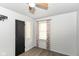 Cozy bedroom features a window with patterned curtains and light gray walls at 1700 N Tibbs Ave, Indianapolis, IN 46222
