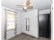 This bedroom boasts built-in storage and a ceiling fan for added comfort at 1700 N Tibbs Ave, Indianapolis, IN 46222