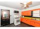 Functional kitchen featuring white appliances, bright cabinets, and ample counter space at 1700 N Tibbs Ave, Indianapolis, IN 46222