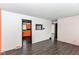 Open-concept living room showcasing dark wood floors and bright wall paint at 1700 N Tibbs Ave, Indianapolis, IN 46222